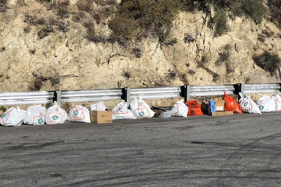 A line of plastic trash bags along the highway